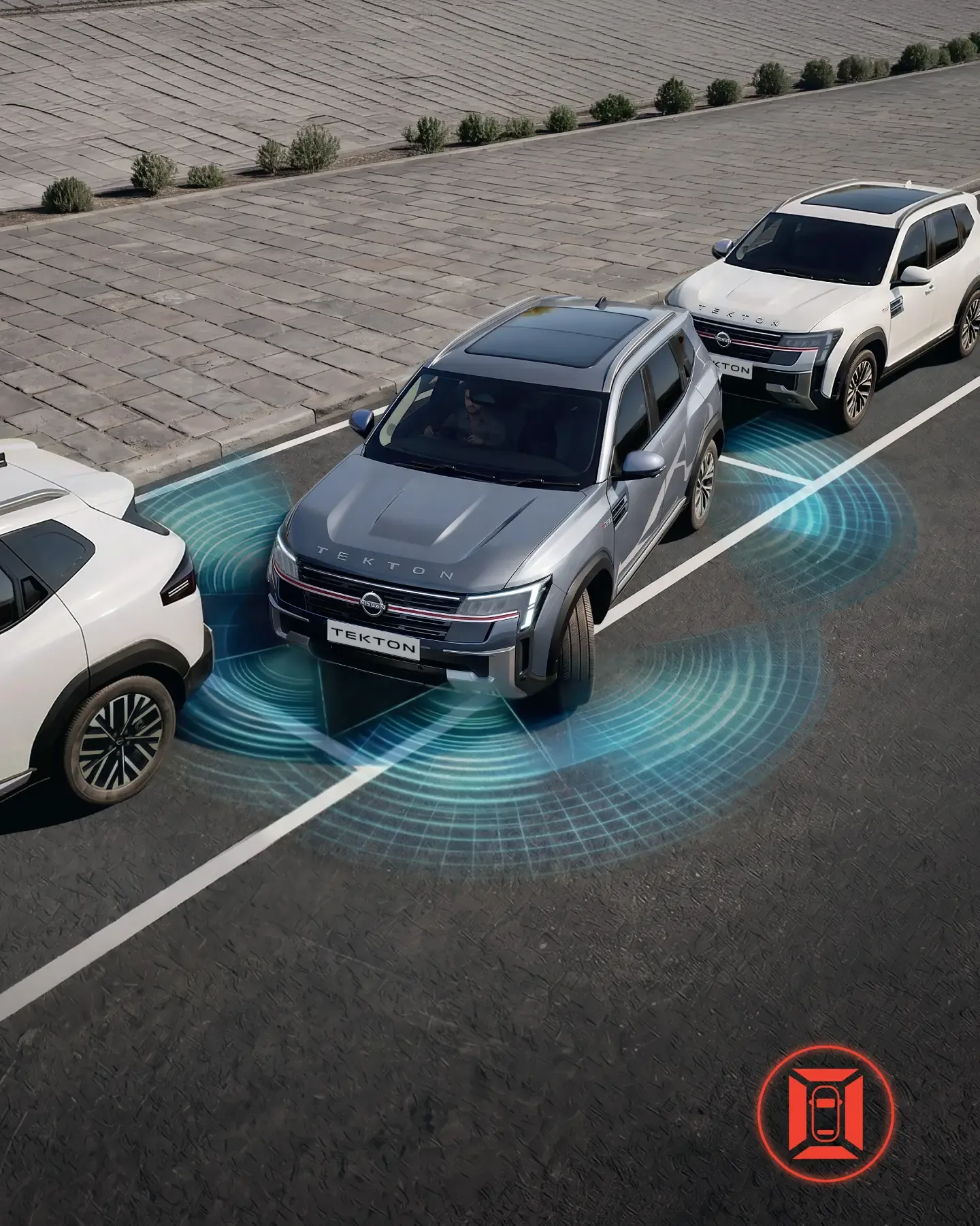 Parking sensors and cameras guiding the Nissan Tekton into a bay